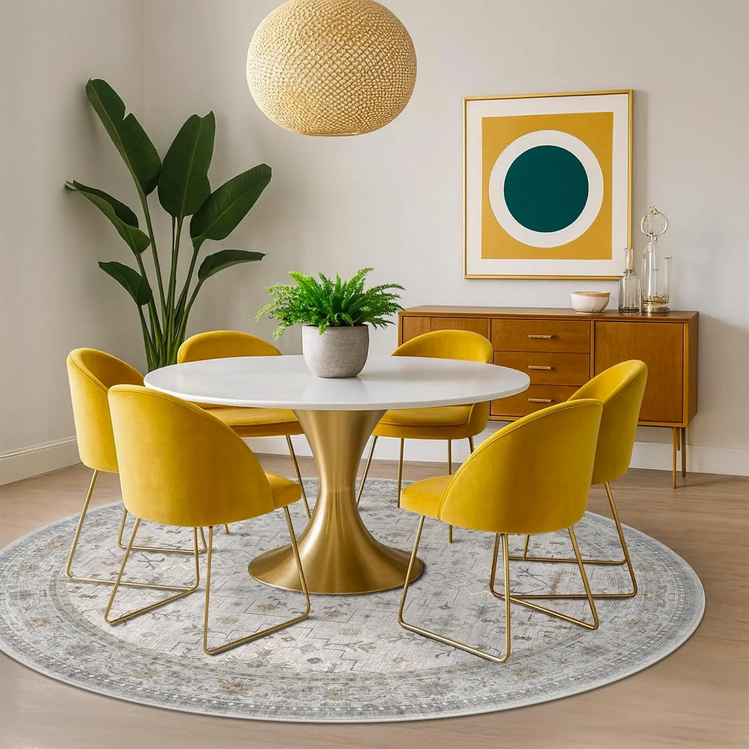 A round HazoHaus rug under a round dining table with yellow chairs